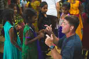 jason praying with children in india